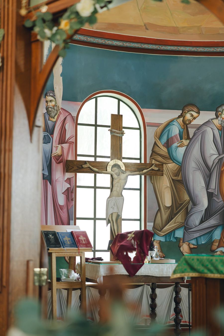 Crucifix before the altar frescoes